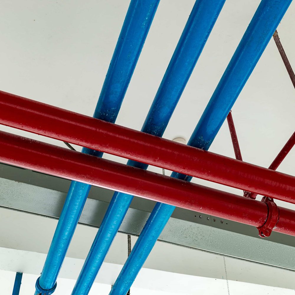 red and blue fire suppression pipes